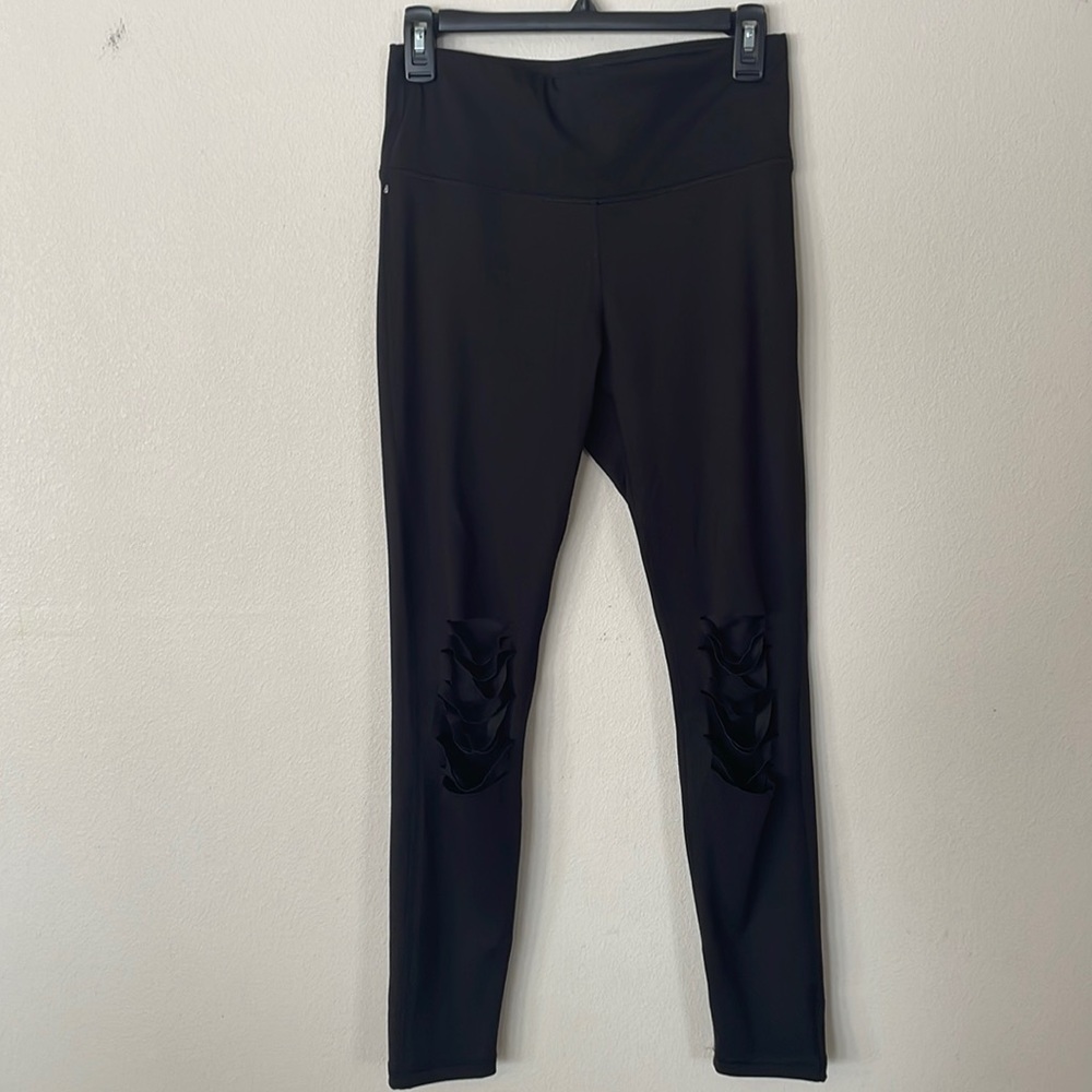 Boutique black “distressed” leggings